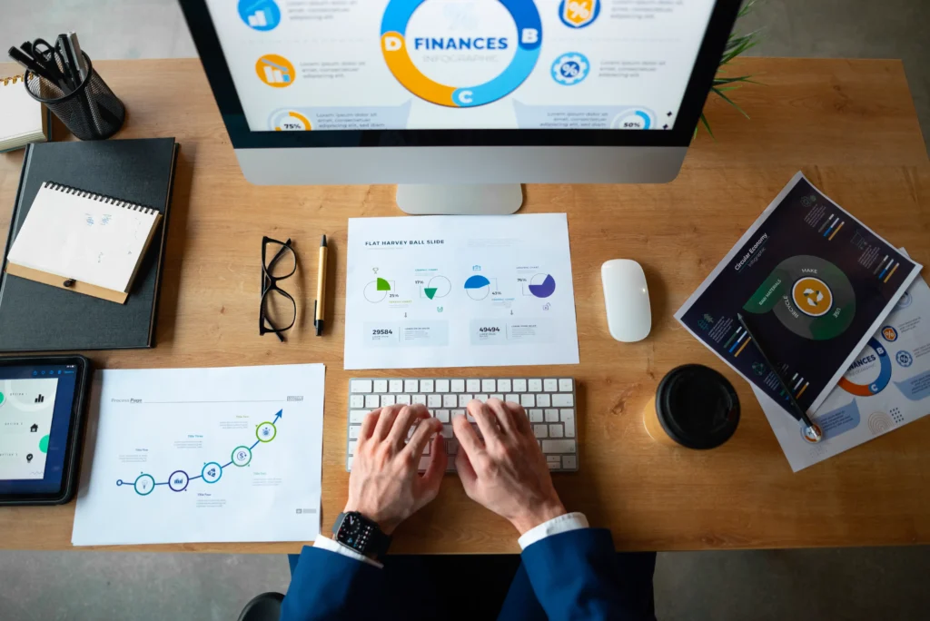 Person analyzing and checking financial graphs in office